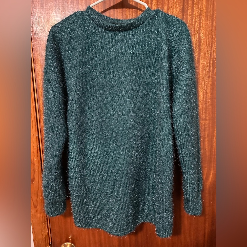 Boutique teal sparkly sweater. Love the back detail. Never worn